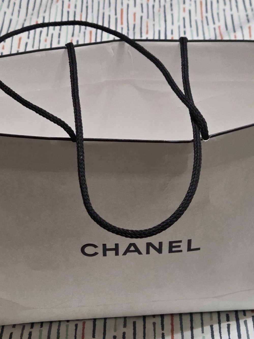 CHANEL Paper Shopping Bag in White with Black Handles